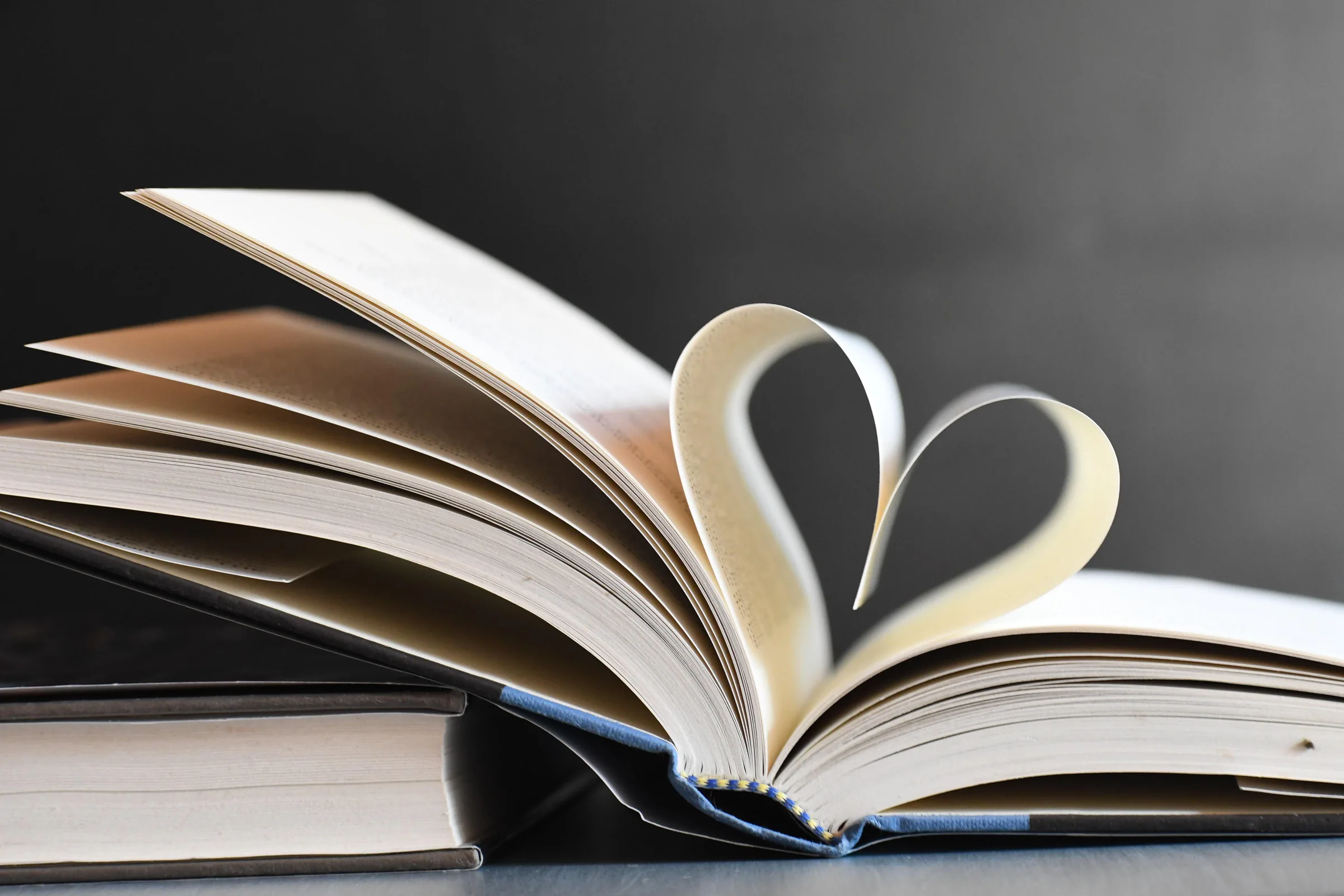 An open book with pages turning